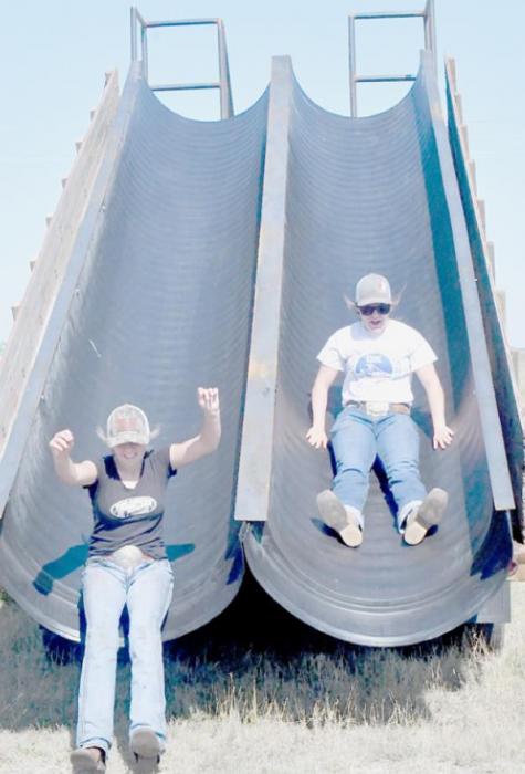 Gracie Kinney and Bailey Bowen enjoy the homemade double slide.