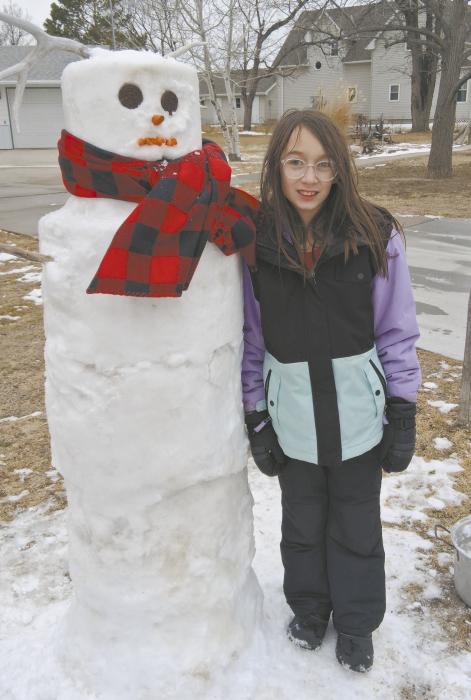 Ainsworth’s Cecilia Kerrigan created a snowman during the region’s recent snowfall.