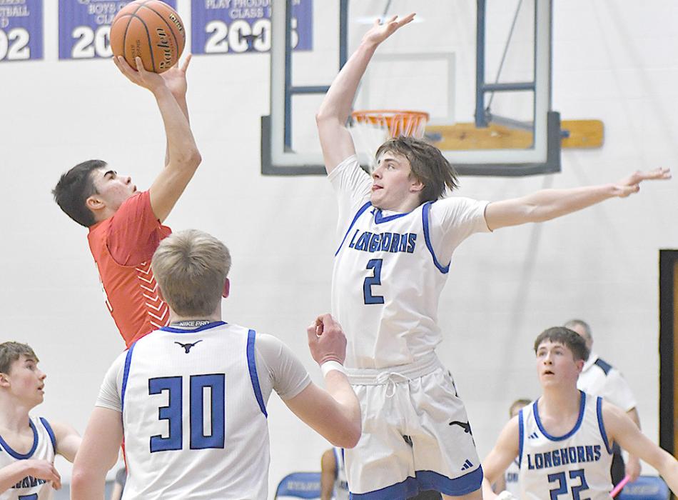 Fernandez goes up for a shot as Hyannis’ Beau Rice tries to block him.