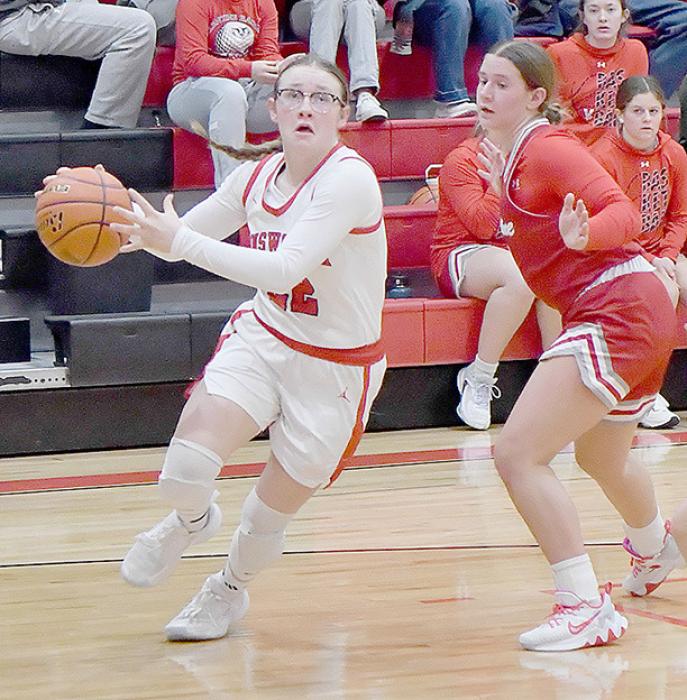 Gracyn Painter drives the baseline against Valentine during Ainsworth’s 46-21 win over the Lady Badgers.