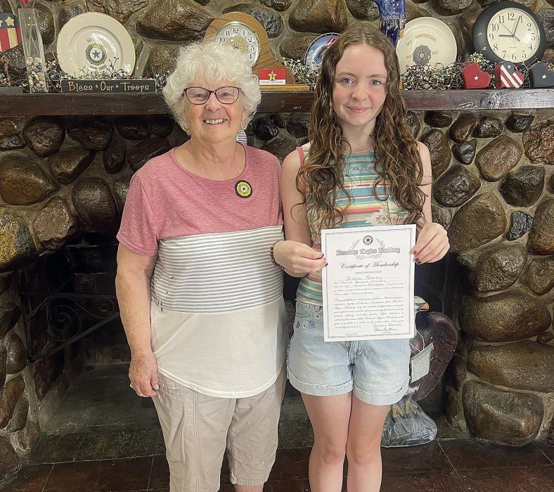 Shari Luther awards recent Ainsworth graduate Jordan Beatty her certificate of membership. Beatty has graduated from the American Legion Post 79 Junior Auxiliary.