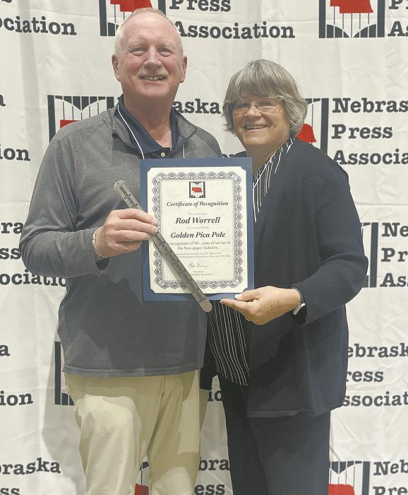 Rod and Kathy Worrell accepted the Golden Pica Pole Award during the Awards Luncheon at the Nebraska Press Association Convention.
