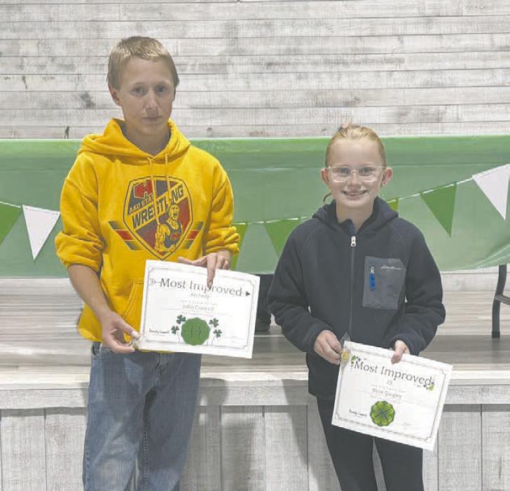 JohnConnellandNeveQuigleywereawardedastheMostImproved Shooters in disciplines of Archery and .22.