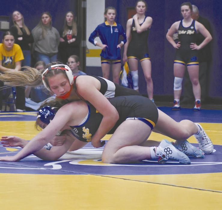Megan jones takes on an opponent from West Holt during the team’s first outing at the West Holt Quadrangular. Jones, a senior, is a two time girl’s state wrestling qualifier.