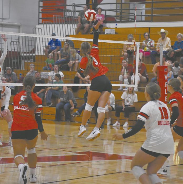 Senior Megan Jones swings at the volleyball during the team’s jamboree match with Cody-Kilgore.