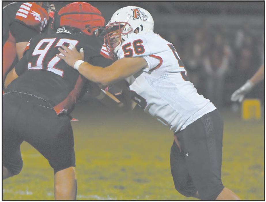 Sophomore Kyle Fernandez pushes back EPPJ defensive lineman Justice Blecher.