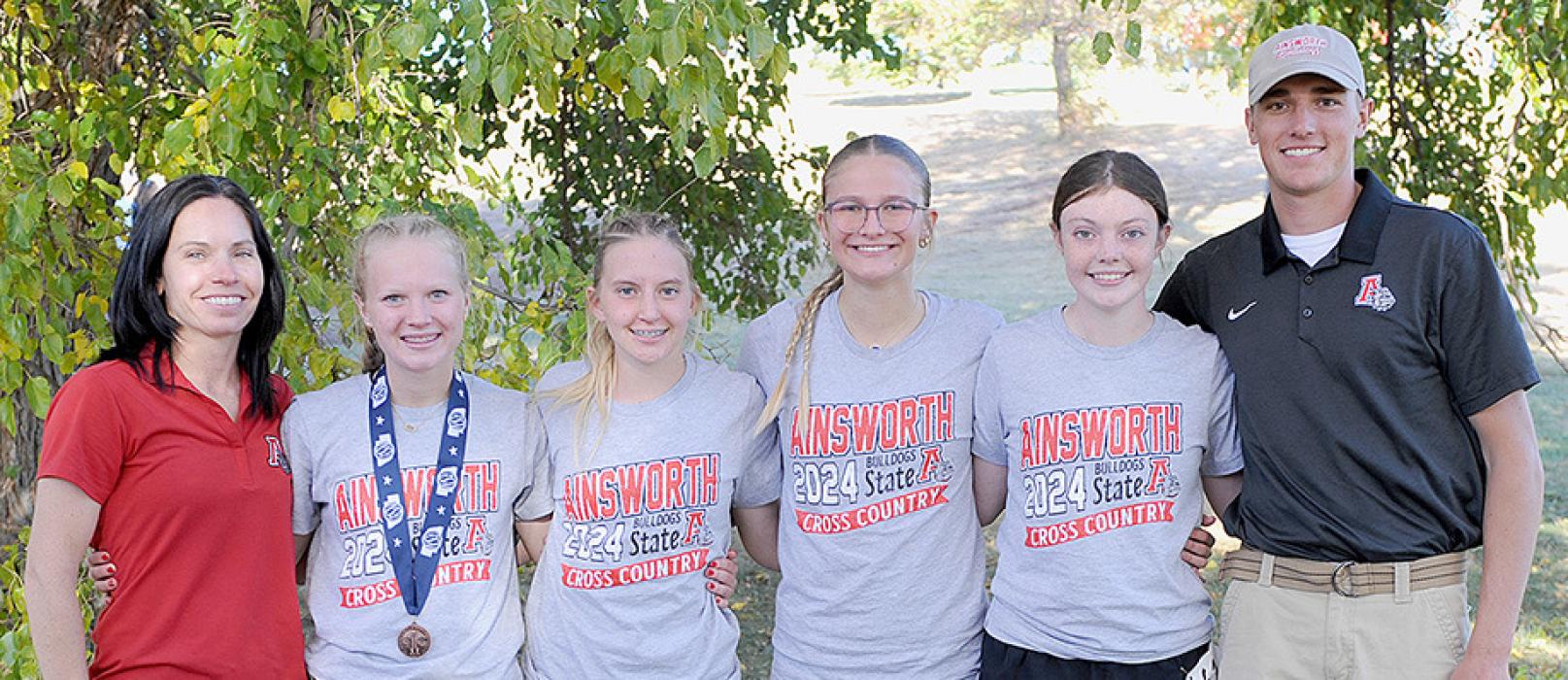 The Ainsworth Cross Country Team competed in the 2024 NSAA State Cross Country Championships in Kearney, NE on October 25th. The girls competed as a team and individually. Kiley Orton placed 15th individually and received a medal. The team placed ninth. Team members were (Left to Right) Co-Head Coach Katie Winters, Kiley Orton, Preselyn Goochey, Emma Kennedy, Payton Moody and Co-Head Coach Trey Schlueter. Photos by Chera Sisson