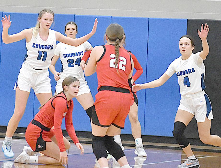 Gracyn Painter shoots the ball from beyond the threepoint line. She had two three-point baskets on the night.