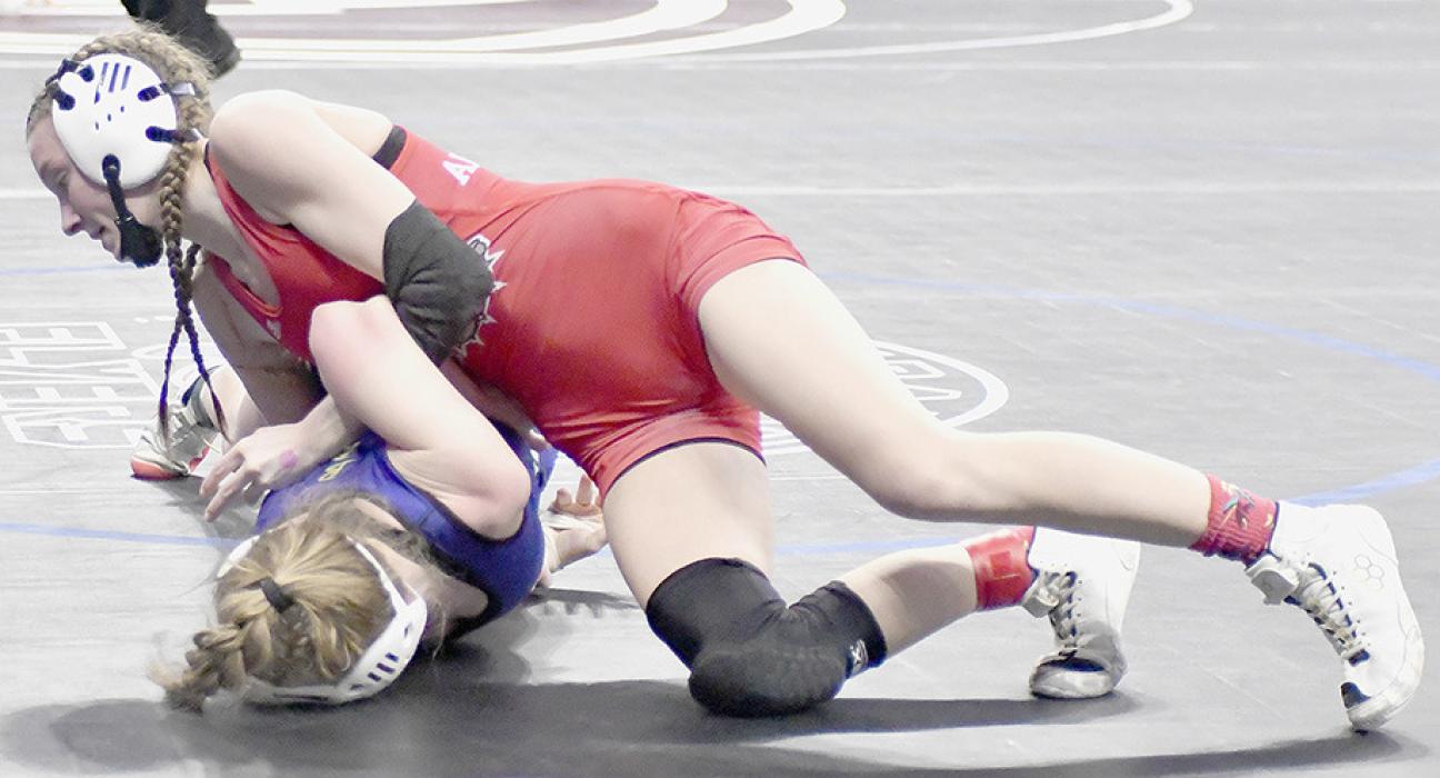 In her Quarterfinal match, Jolyn Pozehl won by an 8-6 decision over Ella Reeves of Battle Creek.