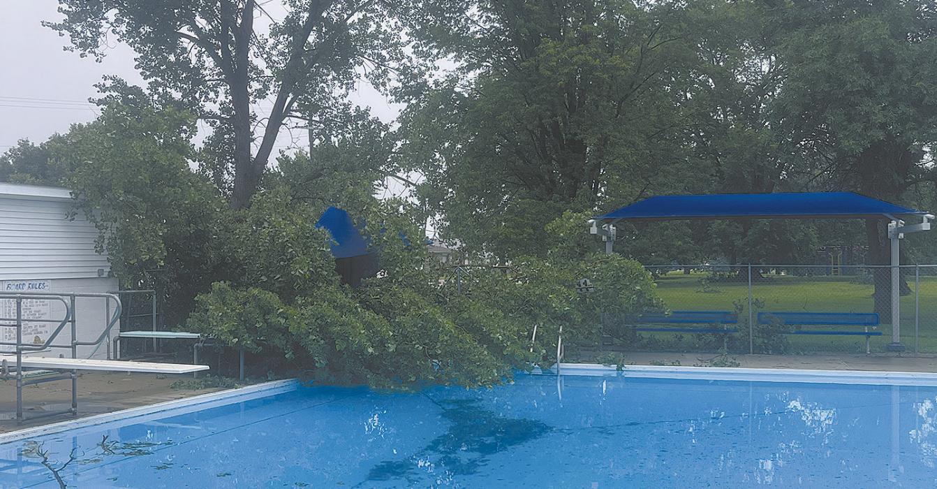 A downed tree took out the fence at the Ainsworth Community Pool, nearly falling into the water. City crews worked to remove downed trees throughout Ainsworth on Monday, July 21.