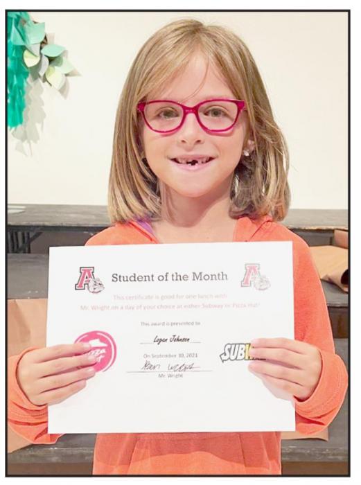 Second grader Logan Johnson (right) was selected as the September Student of the Month at McAndrew Elementary.
