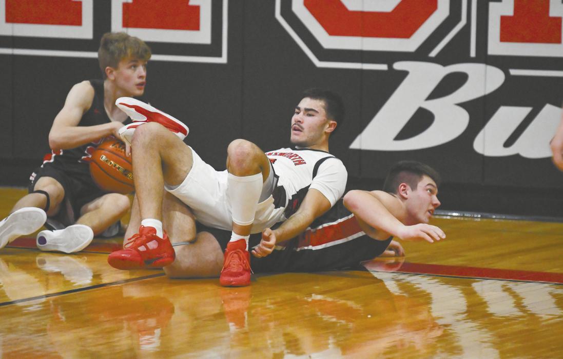 Senior Chris Fernandez finds himself in a pileup after diving for a loose ball against the Indians.