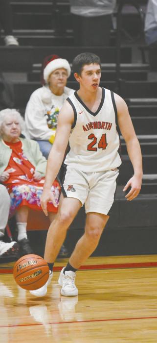Sophomore Bear Rae dribbles around his opponent during the team’s game against the Broken Bow Indians.