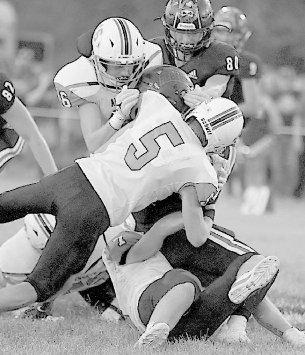 Ainsworth defense wraps up an Arcadia-Loup City running back. Photo by Jennifer Schuett