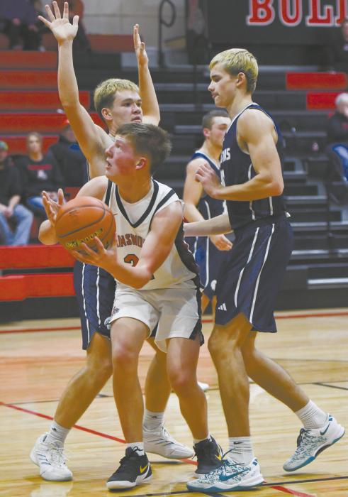 Sophomore Jaxon Rucker attempts to break through Boyd County’s defense to get a shot up. Rucker had four points against Boyd County.