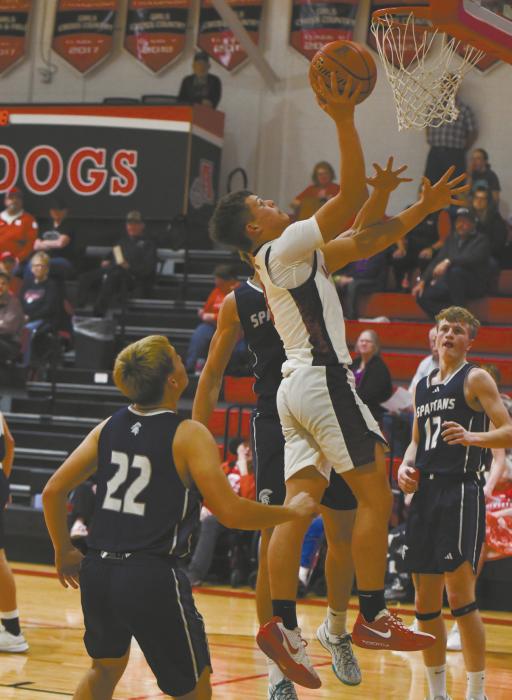 Sophomore Zaine Evans goes up for a layup during the game against Boyd County. Evans had six points in the game.