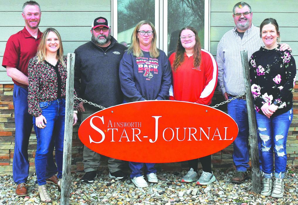 The Star Journal has found its new home next to the KBRB radio station on Main Street in Ainsworth. Above are the new owners and managing editor, Kirk and Chelsey Peterson, Clint and Katie Painter, Erin Painter, and Graig and Stephanie Kinzie.