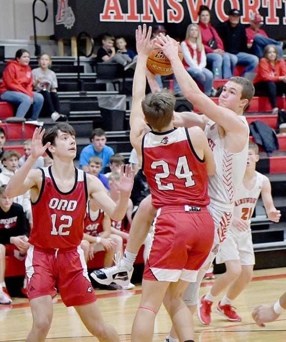 Logan Schroedl drives for the basket against Ord. Schroedl led the Dawgs in scoring with 7 points.