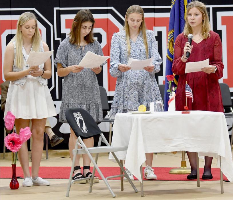 The senior members of the American Legion Junior Auxiliary Unit #79 are (Left to Right): Jayden Keezer, Maia Flynn, Madelyn Goochey and Alyssa Erthum. They presented the POW/MIA Remembrance Table Service, which symbolizes the toll of the burdens that families face when they cannot be with their POW and MIA family members.
