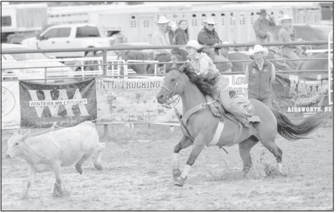 A 2017 graduate of Ainsworth High School, Sydney Graff, throws her lasso during the breakaway roping during the Labor Day. Graff narrowly missed her calf, resulting in a no time. Graff later competed in the team roping with her father, Terry.