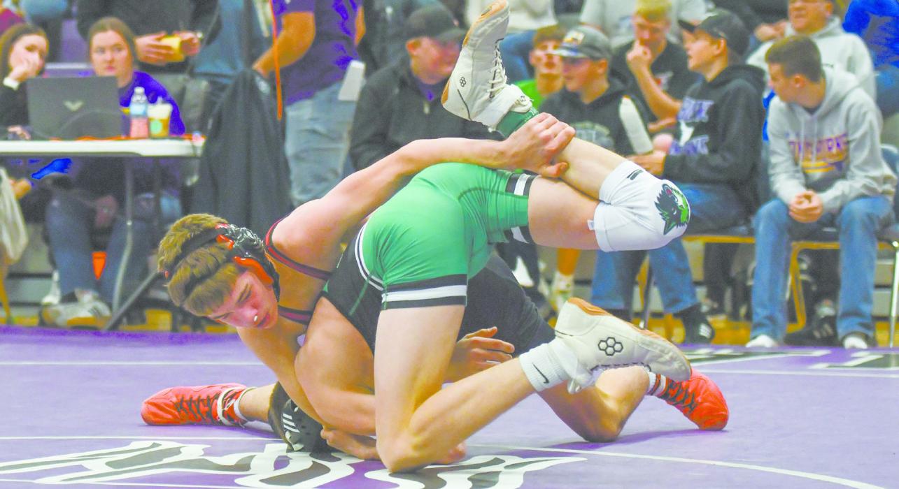 Sophomore Holden Beel wrestles Brendan Booe of Loomis.