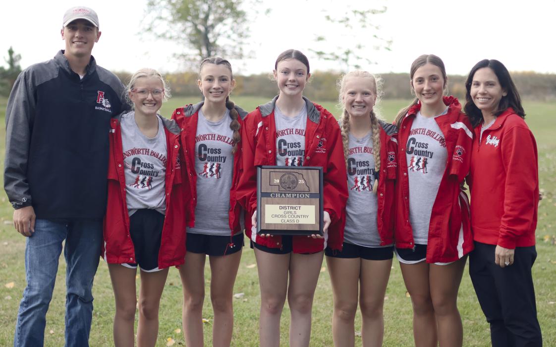 The AHS Girls Cross Country Team qualified as a whole by winning the D-3 District meet hosted at the Ainsworth Municipal Golf Course on Thursday, Ocotber 16. The winning team consists of (left - right): Coach Trey Schlueter, Izzy Painter (38th place), Raegan Moody (second place), Payton Moody (20th place), Kiley Orton (fourth place), Addilyn Doke (33rd place), and Coach Katie Winters.