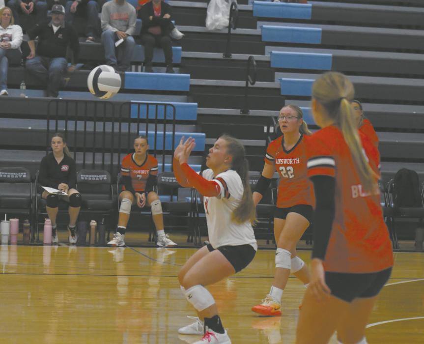 Libero Lily Beel makes an overhead dig off of a hit from a Bobcat.