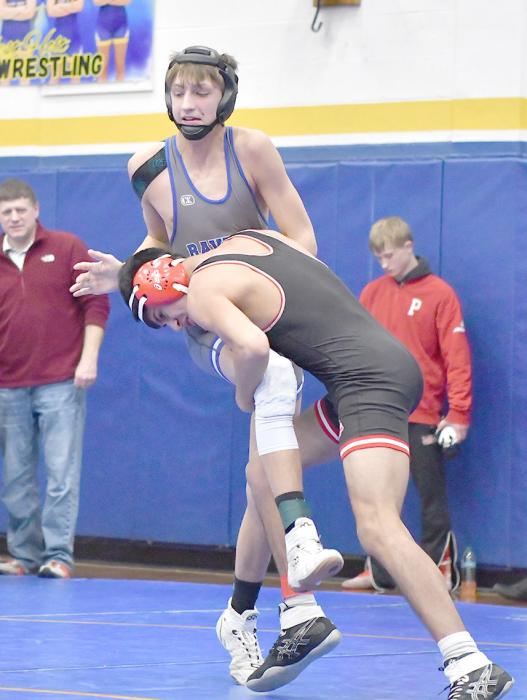 Senior Angel Ajin takes down Taitem Barnes of Ravenna in his final match of the West Holt Tournament.