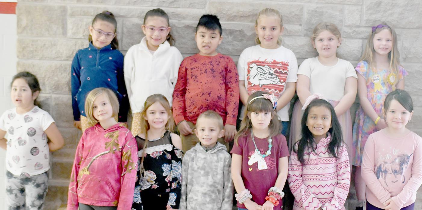 First grade students of Brenda Konkoleski share the ingredients they would use to stuff their Thanksgiving turkeys. Sharing their ideas are (Front Row - Left to Right): Alice Luther, Luna Schroeder, Robbie Cassity, Hazel O’Hare, Karol Sofia Rojas Salazar and MiShayla Palmer; (Back Row - Left to Right): Aleynah Jimenez, Helen Gress Acosta, Alessandra Gress Acosta, Francisco Zumano Cortez, Dallyn Dailey, Sophia Gilbert and Joslin Coleman.