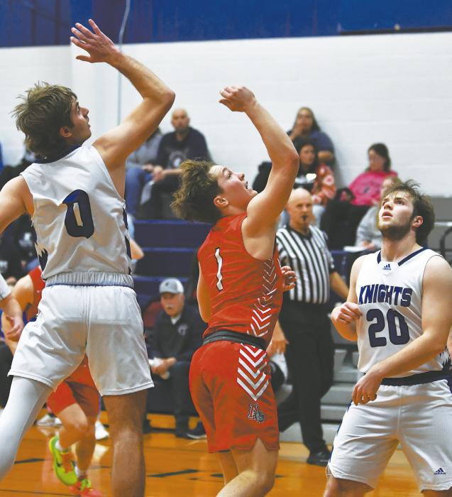 Morgan Kinney Attempts a layup as North Central’s Keian Fischer attempts to block him.
