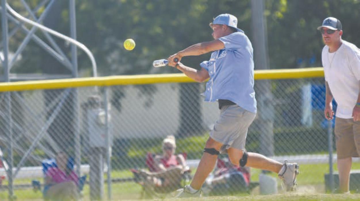 Zaine Evans swings at a softball during the teams third game of the tournament. In total, the team played four games and went undefeated.