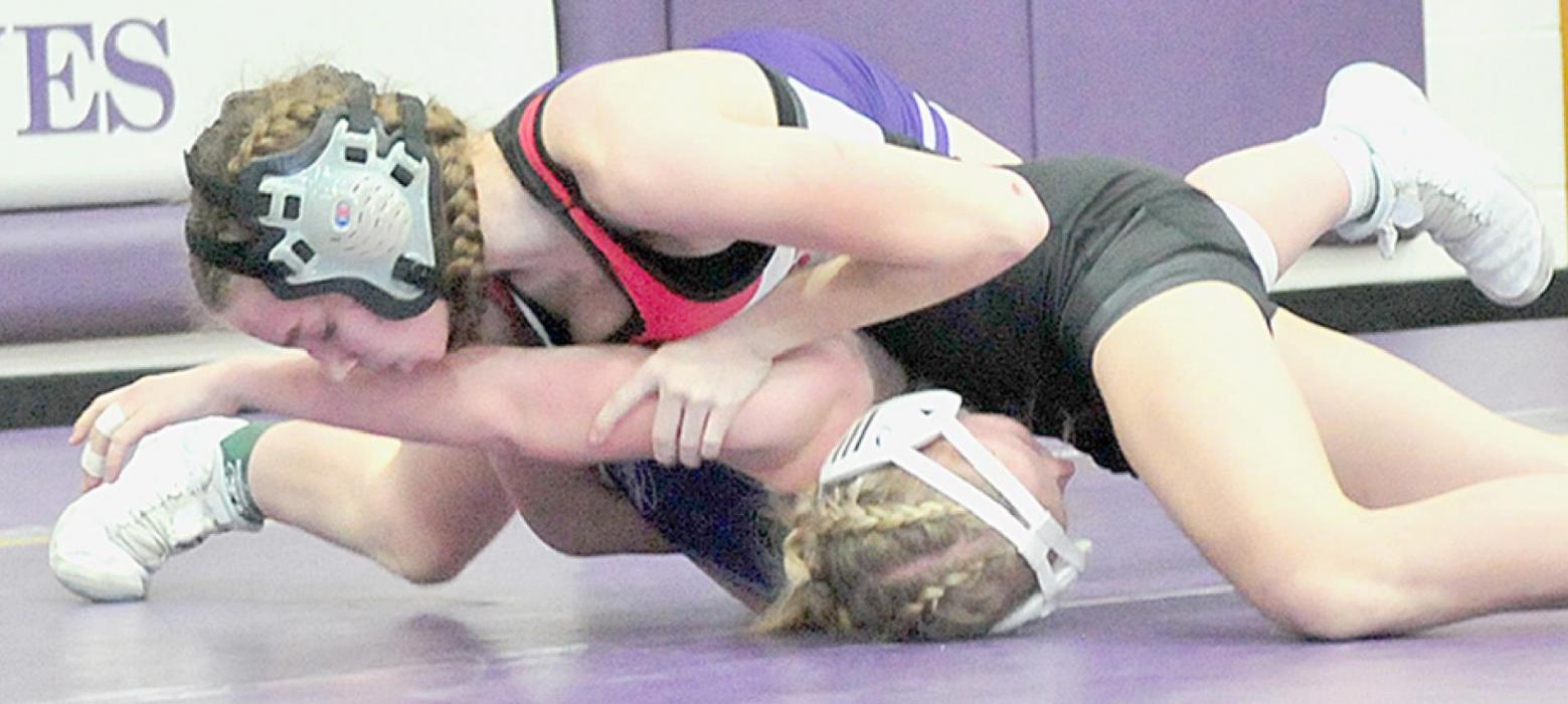 Jolyn Pozehl defeated Ella Reeves of Battle Creek by a 9-0 major decision on her way to another first place medal in the 114 lb. weight class at the Battle Creek Invitational.