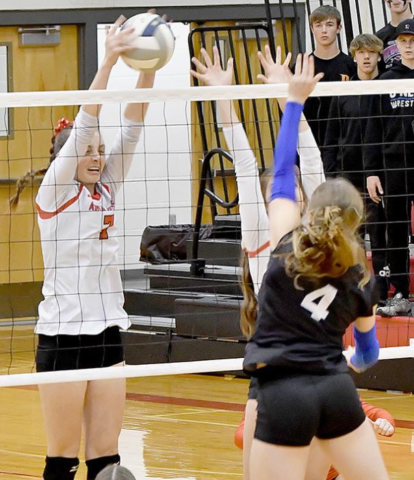 Cameryn Goochey goes up against O’Neill’s Olivia Young at the net. Bulldogs defeated the Eagles in three straight sets.