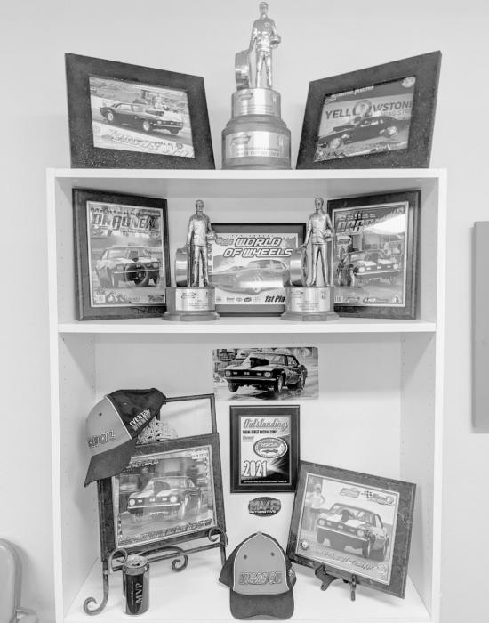 VonHeeder now has four Wallys – the most highly-acclaimed trophy in drag racing. Three are pictured above, and the fourth is “parked” at his father-in-law Bob Buckles’ nursing home. “My dad has always been a huge drag racing fan. He’s so proud, because it’s something every drag racer dreams of,” said Mark’s wife, Angie. This display of trophies and photos is in Angie’s office at KBRB.