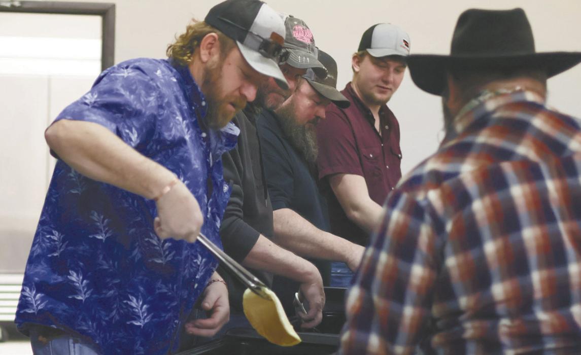 Members of the Johnstown Fire Department serve visitors pancakes and other breakfast food during the freewill donation pancake feed.