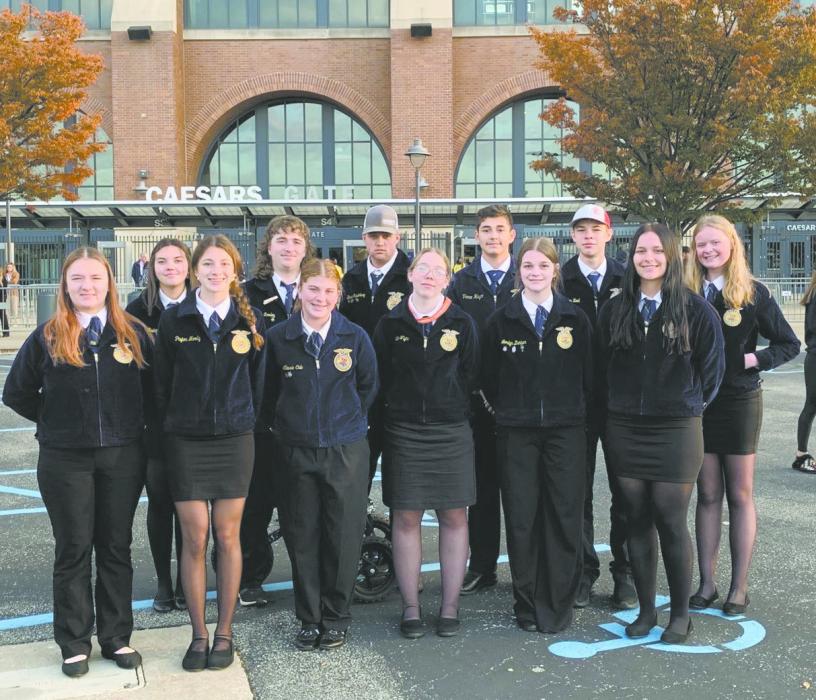 Ainsworth FFA Members stand outside the Lucas Oil Stadium in Indianapolis where the National FFA Convention is held. Attending members were: back row (left - right): Braylin Rudnick, Aiden Rowley, Branden Freudenburg, Cesar Guichard-Mingo, Holden Beel, and Tinley Buechle. Front row: Bristol Goodwin, Reagan Moody, Cassie Cole, Bailey Rea, Londyn Dunbar, and Ella Dailey. Photo Courtesy of Josie Ganser, Ainsworth FFA Advisor