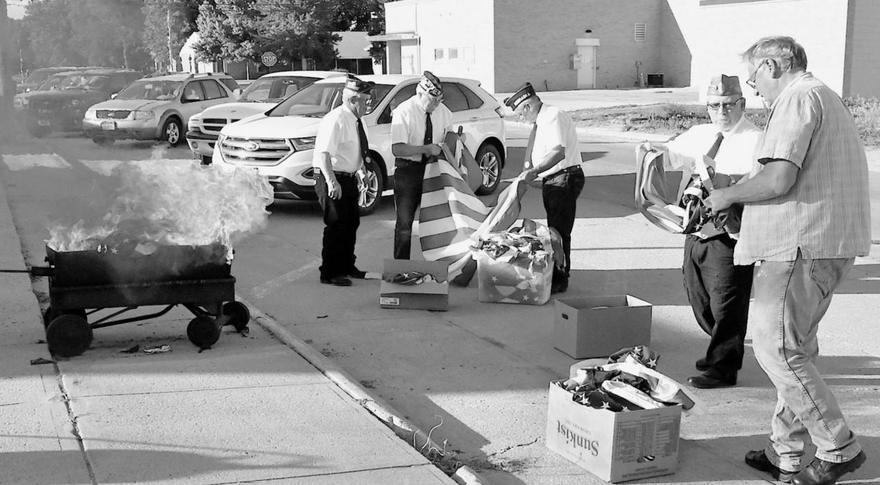 Each year on June 14th, the Ainsworth American Legion Post 79 holds its Ceremony for Disposal of Unserviceable Flags outside the American Legion Hall. Each flag is checked before it is properly disposed of.