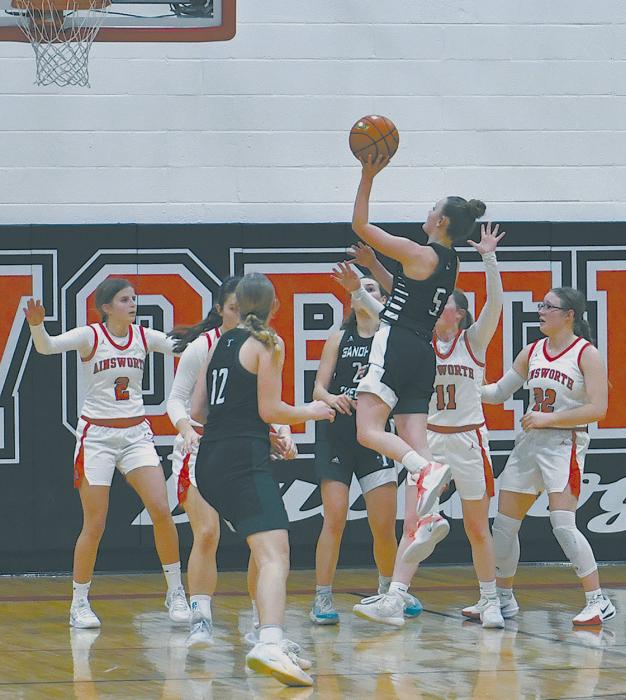 Senior Karley Haake goes over the top of Ainsworth defenders for a two-point basket.