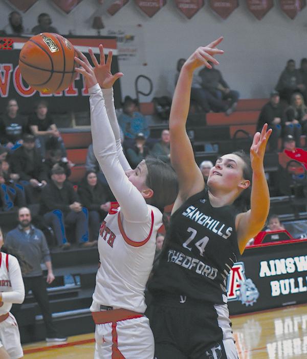 Jaylee Good pulls down a rebound for Ainsworth during the second quarter.