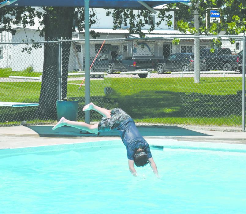 Many local youth flocked to the pool for its opening day, enjoying the diving boards and slide.