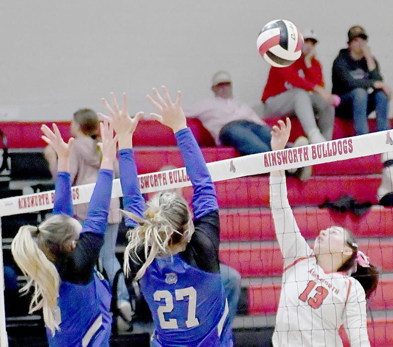 Dakota Stutzman (13), another senior at Ainsworth Community Schools, played her last home game at Lila McAndrew. Here she sends the ball back over to the South Loup defenders.