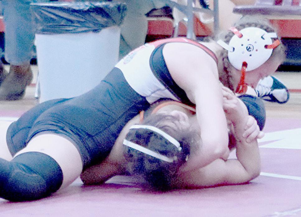 Megan Jones pinned Sara Anaya of Lexington to advance to District competition on February 9th.