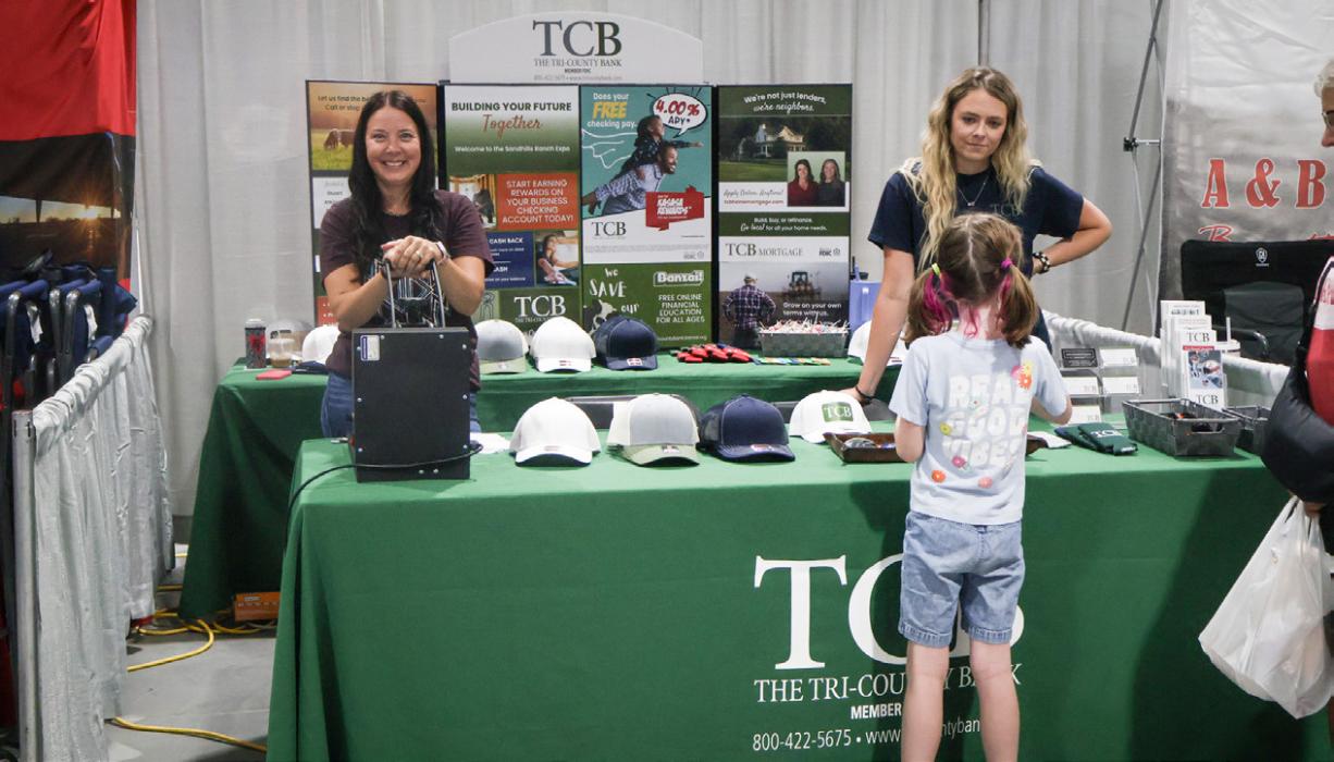 Danielle Palmer (left) of Palmer Embroidery teamed up with Tri-County Bank for a build your own hat station.