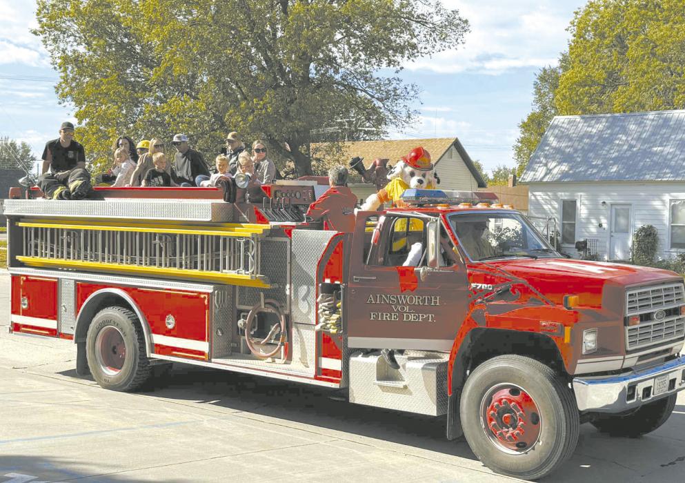 The Ainsworth, Raven, and Long Pine Volunteer Fire Departments visited Little Paws Preschool and Ainsworth Elementary School October 9-10 for Fire Prevention Week. The fire departments visited classrooms and gave students rides on the fire trucks around town. Photo Courtesy of Scott Fuelberth
