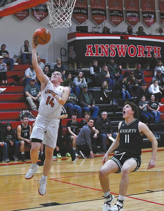 Ryan Salzman goes up for an easy lay-up against Sandhills/Thedford. An aggressive defense held the Knights to only six points in the first quarter.