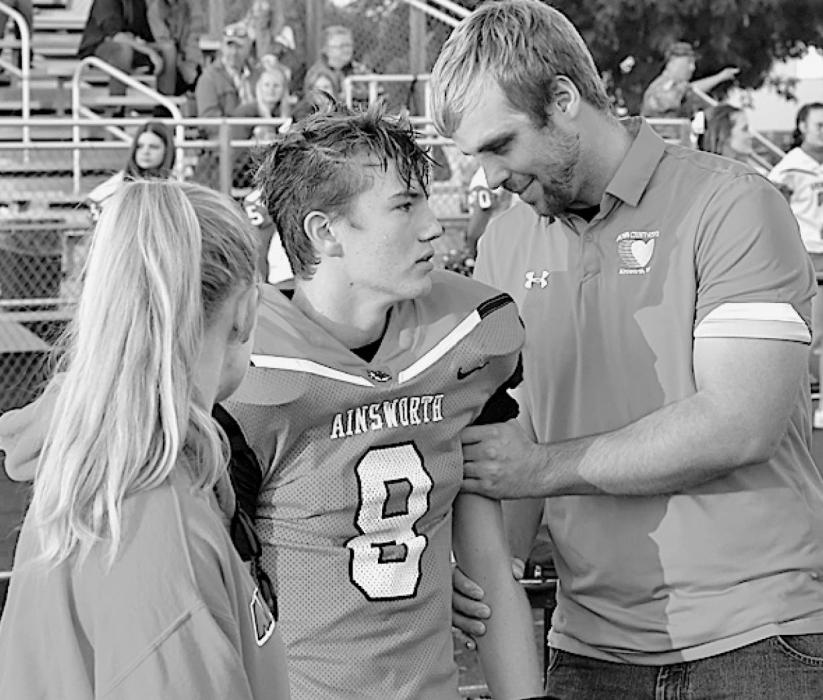 Each football game, either or both Robby France (right) and Katie Leymaster (left) of the Brown County Hospital Rehabilitative Services are present to provide Ainsworth’s players with assistance. Traegan McNally took advantage of their services during the game after getting his shoulder and arm jarred during a play.