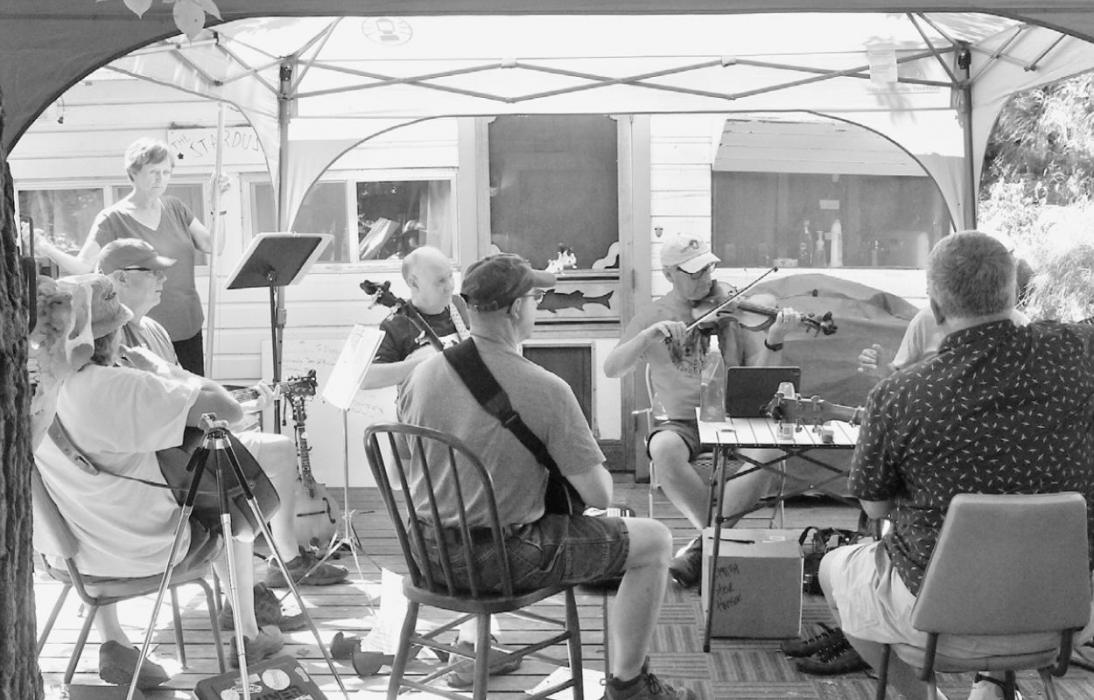 Steve Hanson’s Bluegrass Camp rehearses for their Long Pine Day performance at the Hidden Paradise Pavilion.