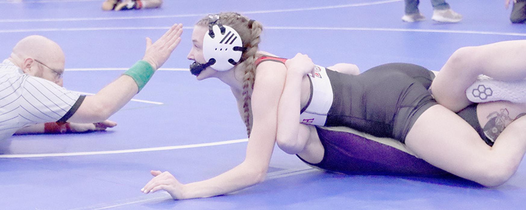 Jolyn Pozehl pins her opponent at the O’Neill Invitational on her way to a second place finish in the 115 lb. weight class. Photos by Jessica Pozehl