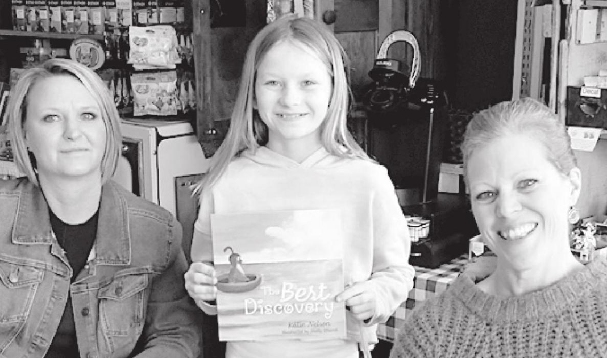 A book signing for “The Best Discovery” was held at the Book Peddler on Saturday, March 20th. Madelynn Nelson (center) gets her book signed by illustrator Shelly Strand (left) and author Katie (Nelson) Rau (right).