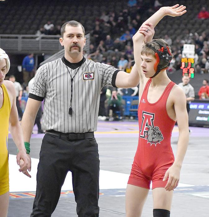 Beel has his hand raised after winning his match against Weston Putnam of Elm Creek. Beel went 2-2 at the state tournament.